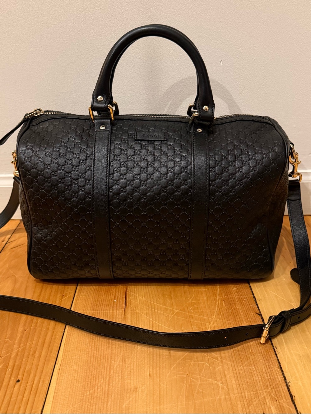 Gucci Microguccissima Boston bag with top handles and detachable shoulder strap.